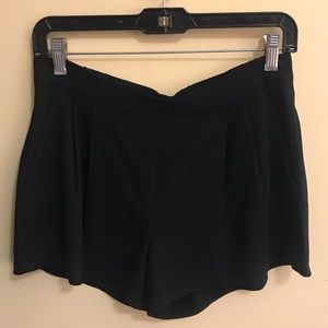 Aritzia Babaton black silk pleated shorts